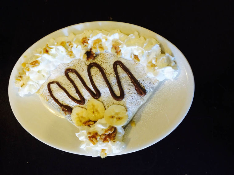 The Nutella served with Banana and Walnuts is one of Pekara Bistro and Bakerys top-selling sweet crepes. The warm tortilla is filled with Nutella and cream cheese and topped with whipped cream, powdered sugar and walnuts.