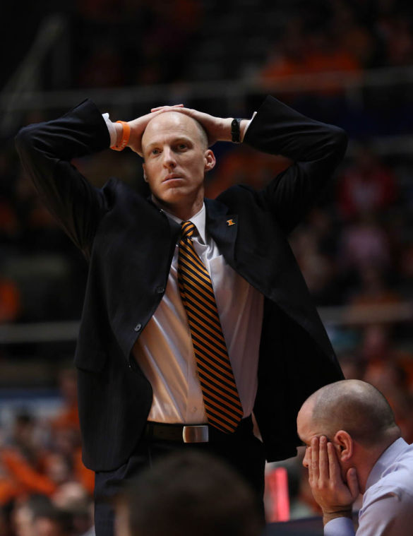 Illinois head coach John Groce reacts to a referees call during the game against Wisconsin at State Farm Center, on Tuesday, Feb. 4, 2014. The Illini lost 75-63.