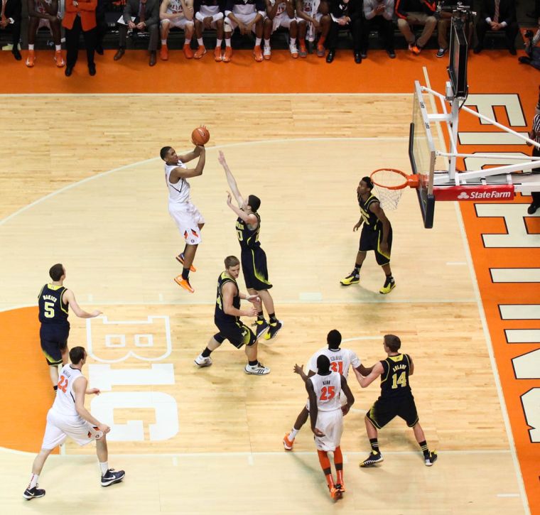 Illinois Malcolm Hill (21) takes a jump shot during the game against No. 12 Michigan, at State Farm Center, on Tuesday, March 4. The Illini lost 84-53.