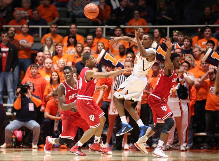 Illinois Tracy Abrams (13) passes after driving to the baseline during the game against Indiana at State Farm Center, on Tuesday, Dec. 31, 2013. The Illini won 83-80.