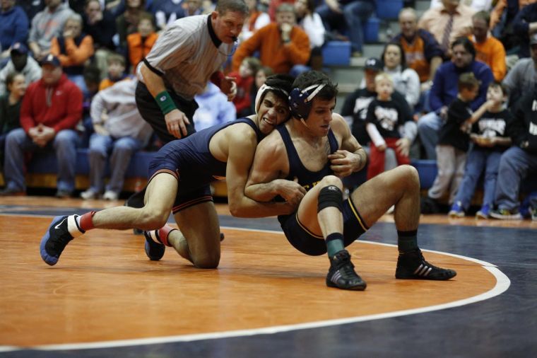 Illinois Jesse Delgado wrestles Michigans Conor Youtsey at Huff Hall on Friday, Jan. 18, 2014.