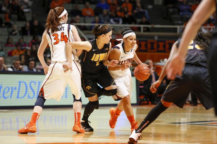 Illinois Amber Moore (42) drives the ball during the game against Iowa at State Farm Center on Sunday, March 2, 2014.