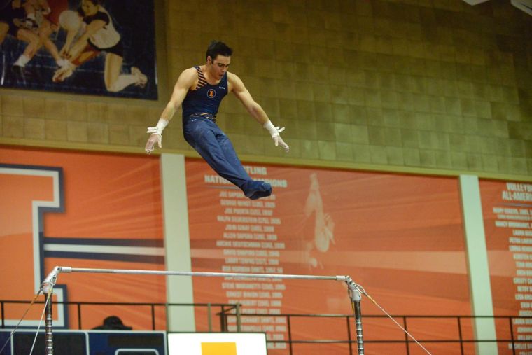 Jordan Valdez performs a high bar routine against Ohio State at Huff Hall on Jan. 26.