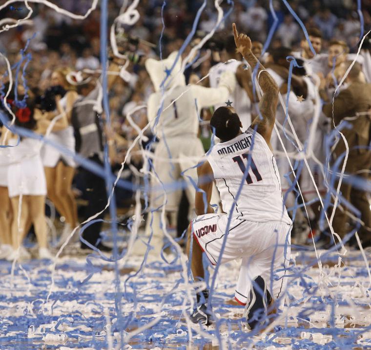 Huskies guard Ryan Boatright celebrates after the Huskies beat the Wildcats 60-54 in the NCAA national championship game on Monday. Boatright scored 14 points in the win. 
 