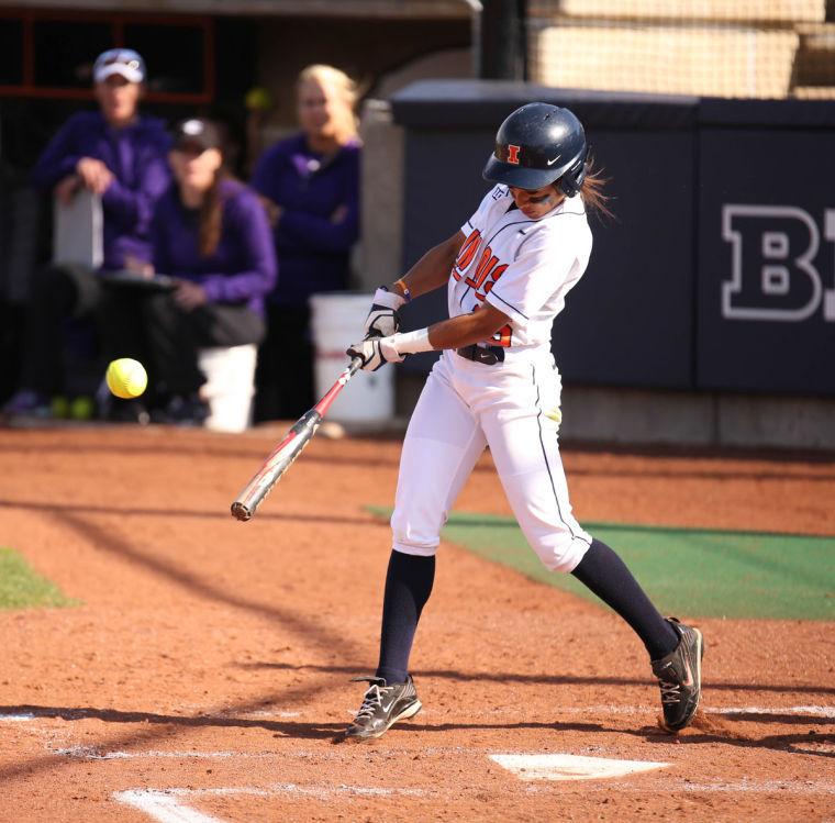Illinois Alex Booker hits the ball during the game against Northwestern on Tuesday, April 22, 2014. The Illini lost 6-3 in the first game of the doubleheader.