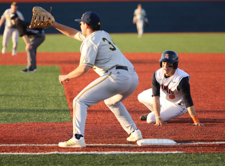 Illinois Adam Walton (6) watches first base after slipping while attempting to dive during the game against Michigan at Illinois field, on Friday. The Illini won 1-0.