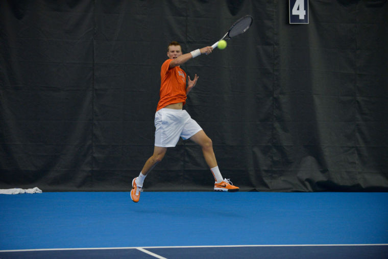 Illinois Brian Page hits the ball during the match against No. 8 Texas at Atkins Tennis Center on Sunday, Feb. 9, 2014. The Illini won 4-3.