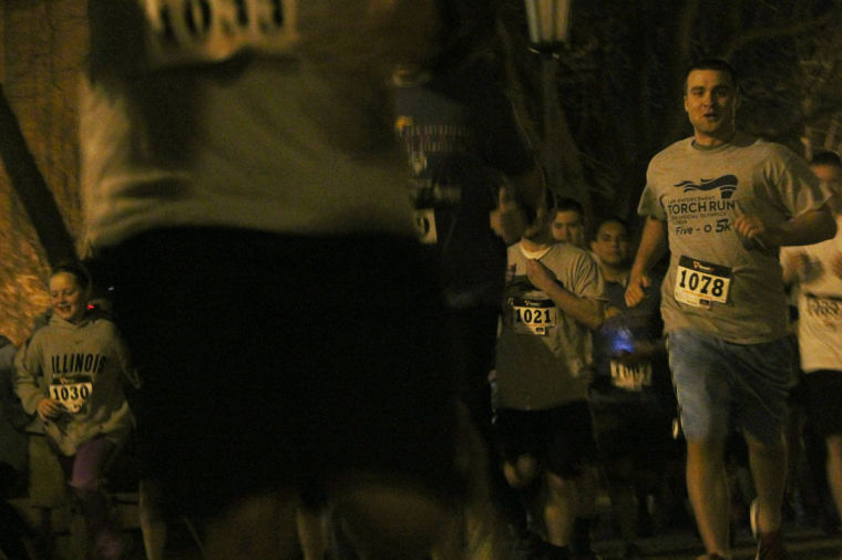 Runners begin the Five-O 5K in Anniversary Plaza on Thursday. The event supported the Special Olympics.