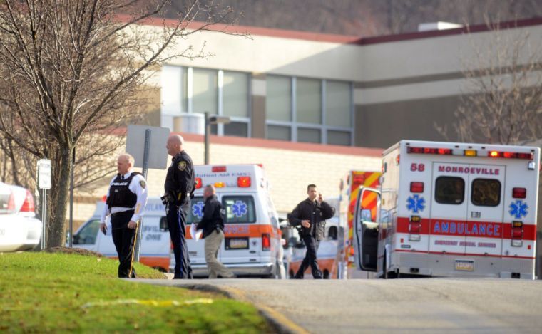 Emergency personnel are seen outside of Franklin Regional High School in Murrysville, Pa., where twenty people were injured — at least four seriously — in multiple stabbings this morning inside the high school, April 9, 2014. Most of the injured were students. 