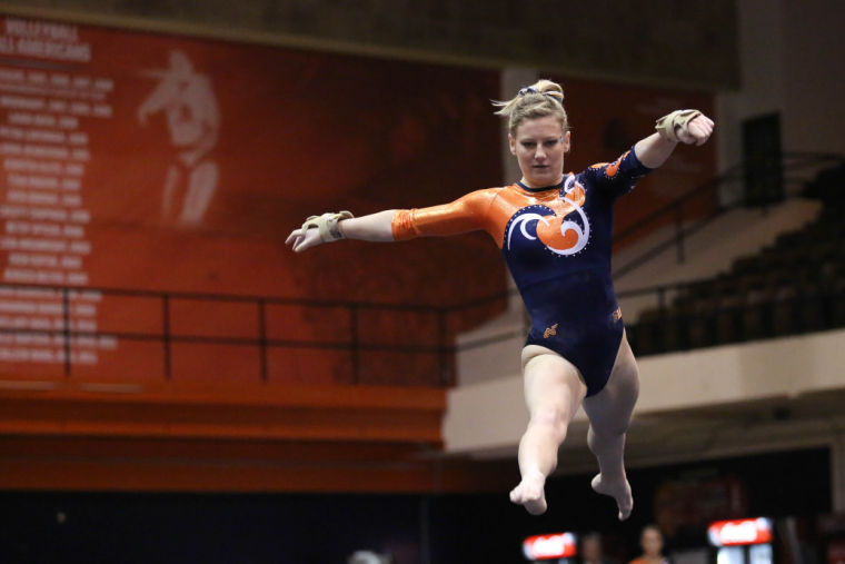 Illinois Amber See performs her floor routine during the meet against Michigan, at Huff Hall, on Friday, Feb.7, 2014. The Illini lost 195.800-195.575