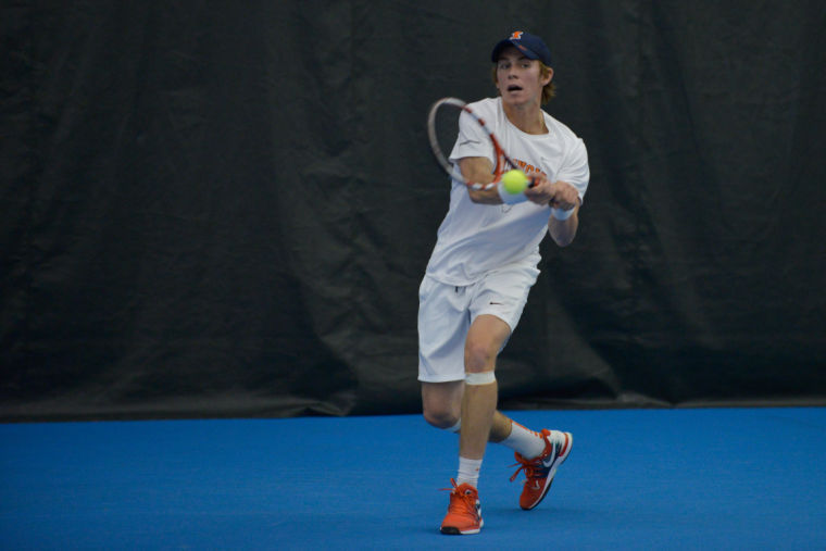 Illinois Ross Guignon hits the ball during the match against No. 8 Texas at Atkins Tennis Center on Feb. 9. The Illini won 4-3.