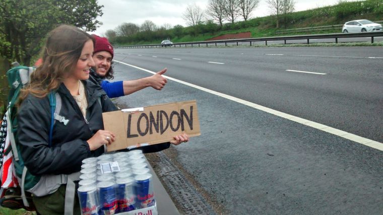 Kailey Luzbetak, Dave Smulson and Tim Lalla carry Red Bull cases to London, England. The students are members of the Corn Stars team in the 2014 Red Bull Can You Make It competition.