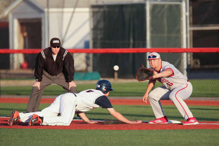 Illinois Ryan Nagle (9) slides back to first base after trying to steal second during the game against Indiana at Illinois Field on Friday. The Illini lost 9-3.