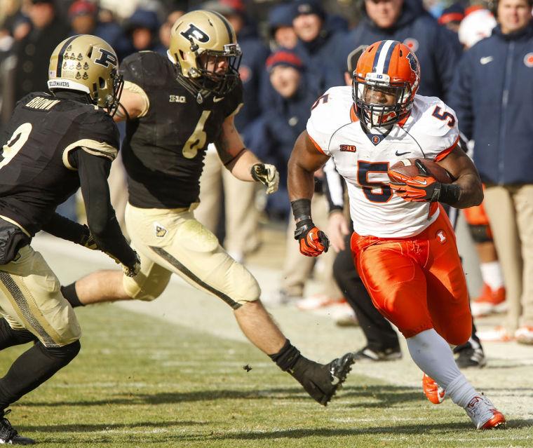 Illinois’ Donovonn Young runs the ball during the game against Purdue on Nov. 23.