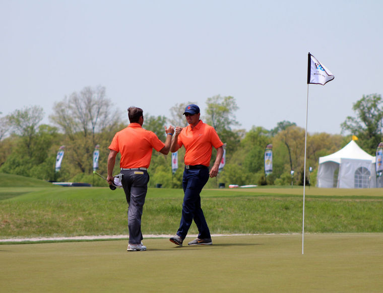 Senior Jonathan Hauter and assistant coach Justin Fetcho celebrate at the Big Ten Championships. The Illini will be a No. 2 seed at regionals. 