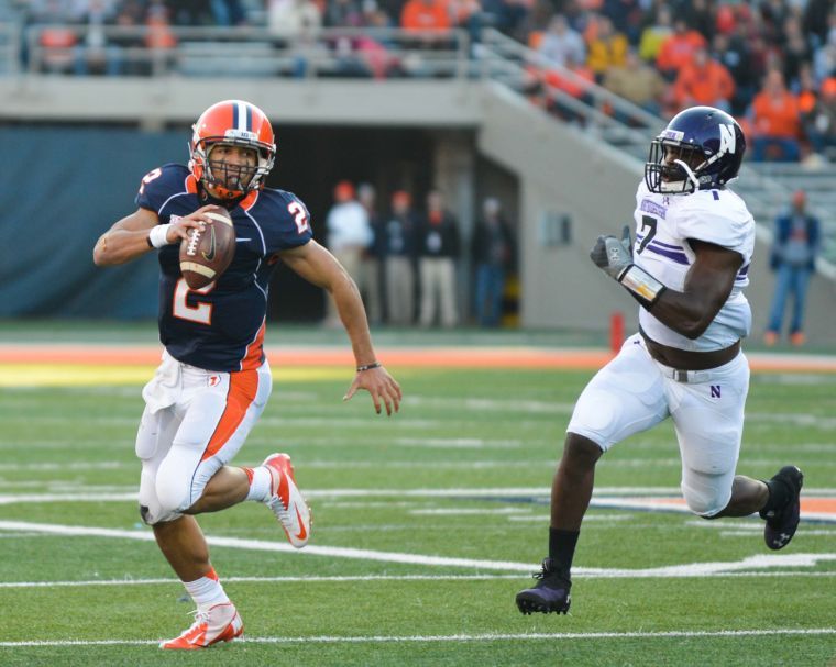 Illinois Nathan Scheelhaase (2) runs the ball during the game against Northwestern at Memorial Stadium in Champaign, Ill. on Saturday, Nov. 30, 2013. The Illini lost 37-34.