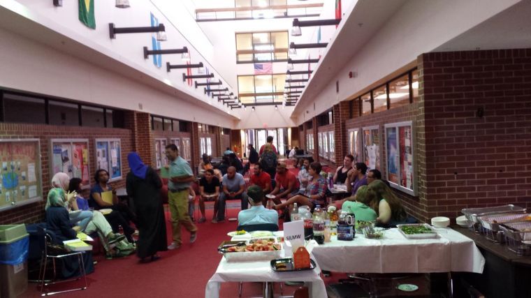 Participants in the 6th Summer Institute for the Languages of the Muslim World gather on Thursday, June 19, for a picnic at the Foreign Language Building.