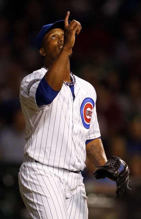 Chicago Cubs relief pitcher Pedro Strop points skyward after retiring the New York Mets David Wright for final out of top of the eighth inning at Wrigley Field in Chicago on Thursday, June 5, 2014. The Cubs won, 7-4.