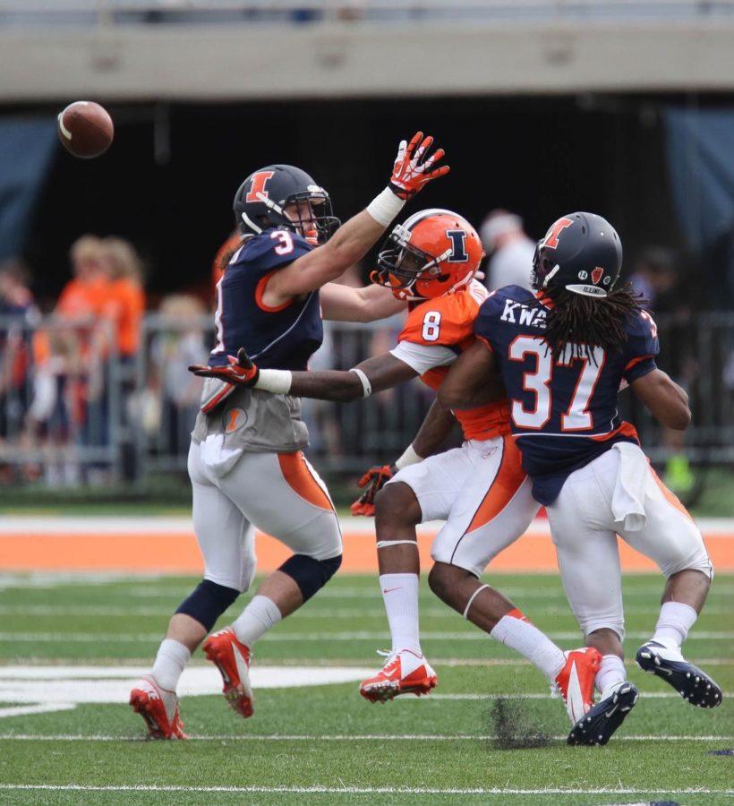 Illinois’ Geronimo Allison (8) reaches out for the ball while being covered by Taylor Barton (3) during the annual Orange and Blue Spring Game on April 13. Allison was a junior transfer to Illinois. 
 