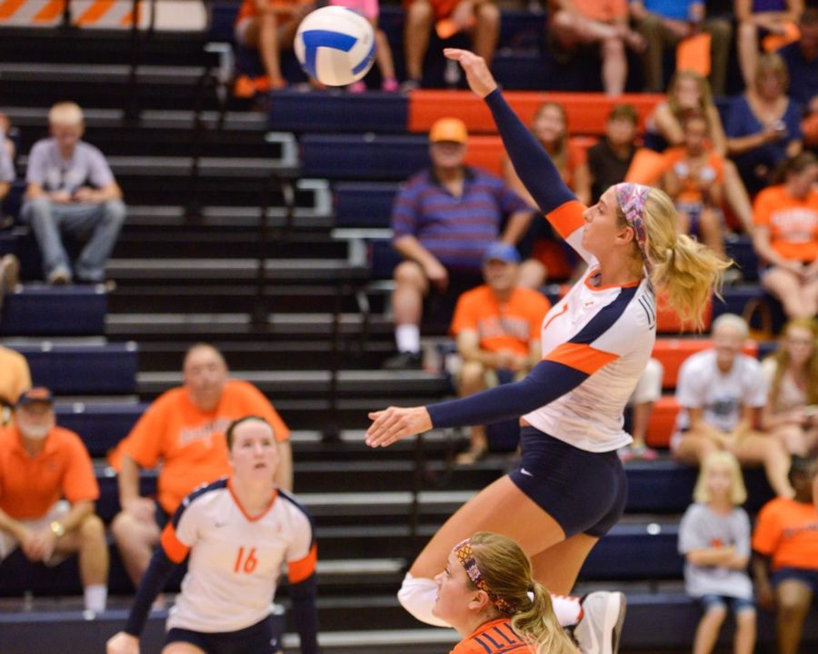 Illinois outside hitter Jocelynn Birks (7) attacks the ball during the Alumni Match on Saturday. The orange and blue teams tied 2-2.