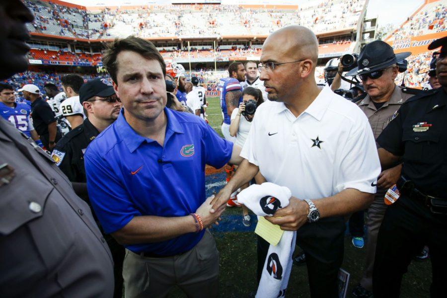 Head Coach Will Muschamp of the Florida Gators shakes hand with Head Coach James Franklin of the Vanderbilt Commodores at the end of the game. The Commodores defeated the Gators, 34-17, at Ben Hill Griffin Stadium in Gainesville, Florida, on Saturday, November 9, 2013. (Will Vragovic/Tampa Bay Times/MCT)
