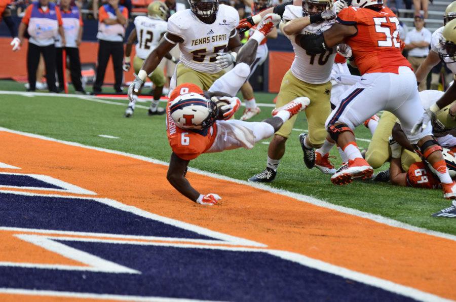Illinois+Josh+Ferguson+%286%29+dives+into+the+end+zone+to+score+a+touchdown+during+the+game+against+Texas+State+at+Memorial+Stadium+on+Saturday%2C+Sept.+20%2C+2014.+The+Illini+won+42-35.