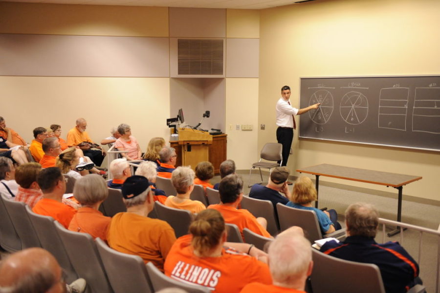 Illinois volleyball head coach Kevin Hambly addresses the Illini Networkers in one of his pregame chalk talks. Hamlby gives fans an insight into the program with a 30-minute presentation before each home match.