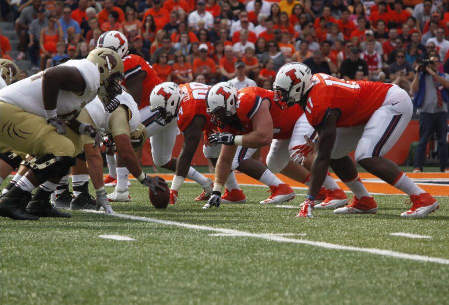 Illinois defensive line gets in to position during the game against Texas State on Sept. 20. The Illini defensive will have to be on top of their game to hold back Minnesotas halfback David Cobb.