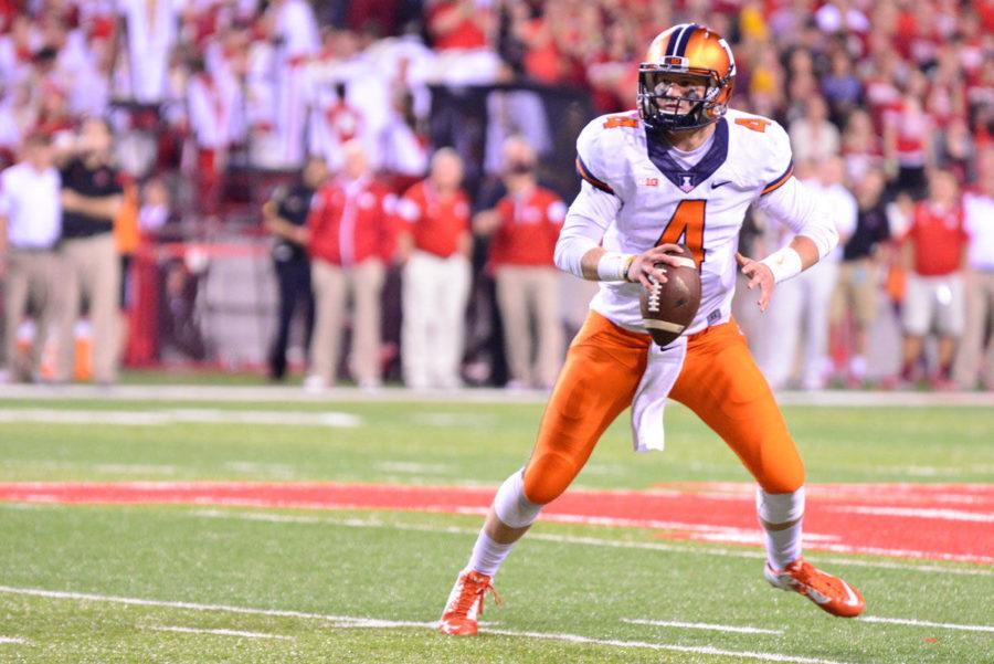 Illinois Reilly OToole (4) attempts to pass the ball during the game against Nebraska at Memorial Stadium in Lincoln, Neb. on Sept. 27. The Illini lost 45-14.
