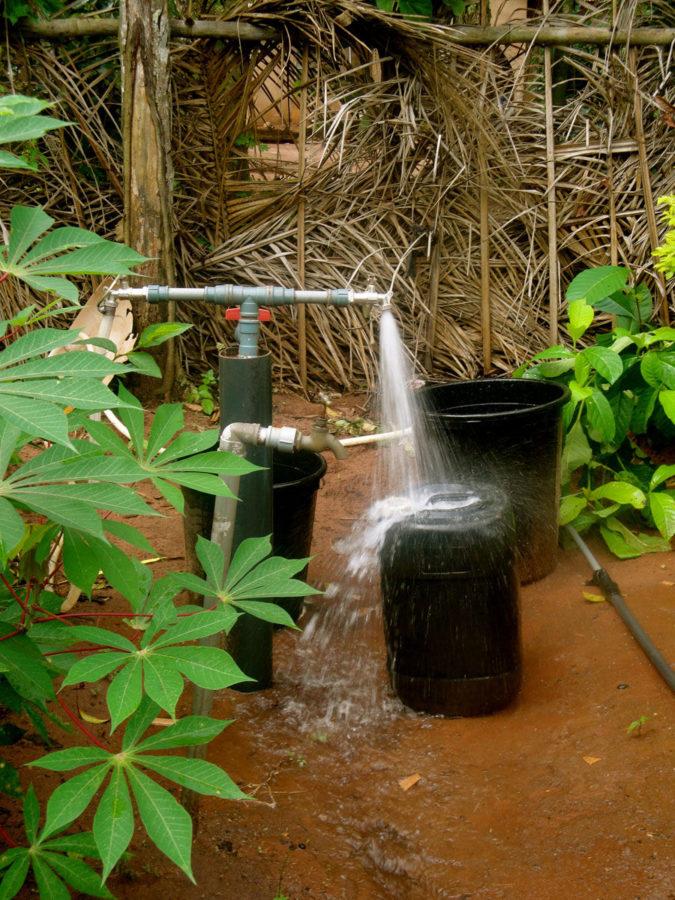 An open tap at a local house in Adu Achi, where the water system implemented by the Universitys EWB branch is running.