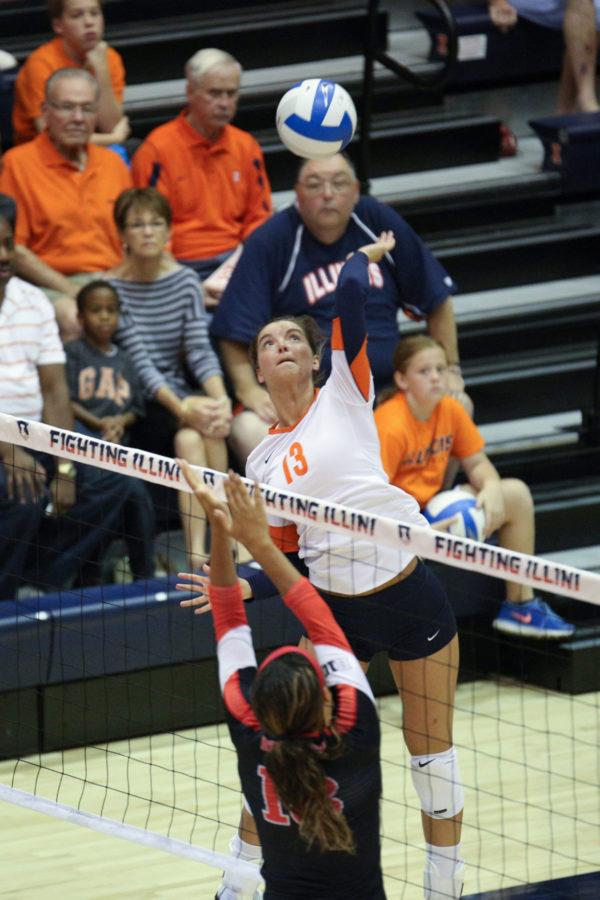 Illinois’ Ali Stark rises up to spike the ball during the game against Rutgers on Saturday. The Illini only have until Wednesday to recover for their first midweek match.