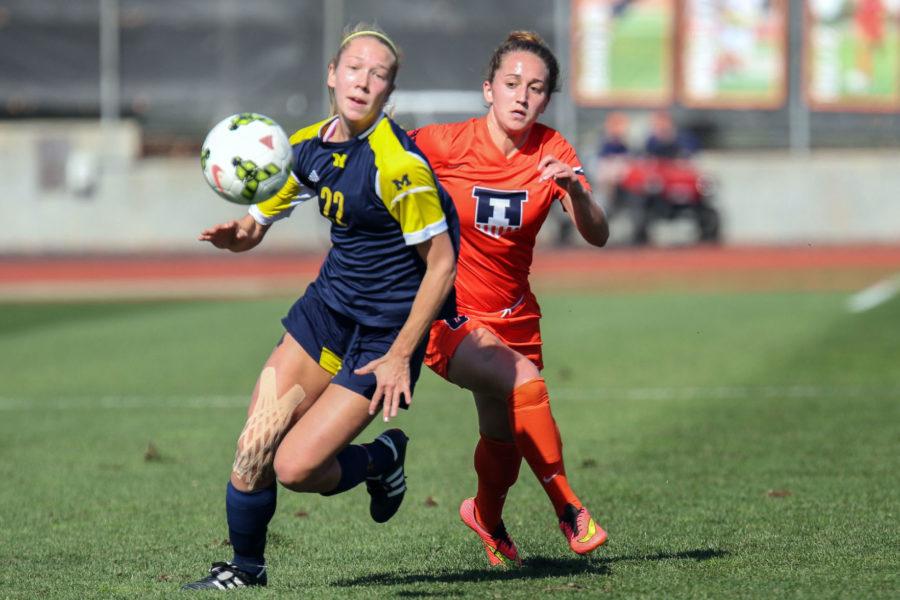 Illinois’ Reagan Robishaw challenges for possession during the game against Michigan at Illinois Track and Soccer stadium on Sunday, Oct. 26. The Illini lost 2-1. Robishaw and her teammates look to prove themselves tomorrow against UW.