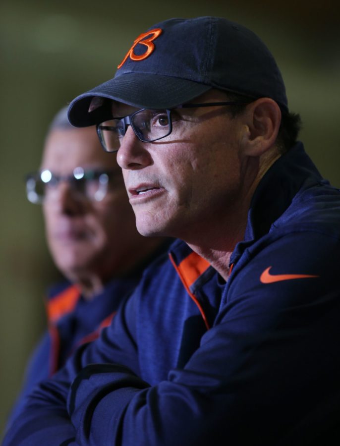 Chicago Bears head coach Marc Trestman (right) answers questions during a press conference at Bears training camp Wednesday, July 23, 2014, in Bourbonnais, Ill.