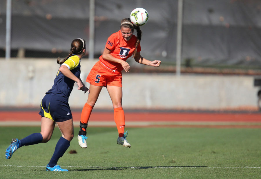 Illinois’ Hope D’Addario rises up for a header against Michigan at Illinois Track and Soccer stadium on Sunday. The Illini lost 2-1.