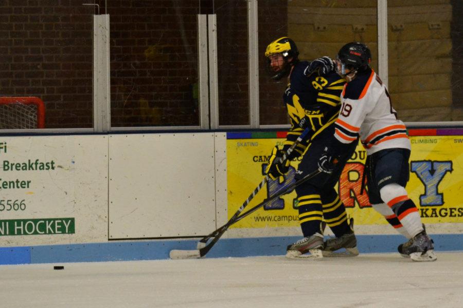 Illinois hockey’s William Nunez fights for the puck during the game against the University of Michigan-Dearborn on Saturday night. The Illini won 5-1.