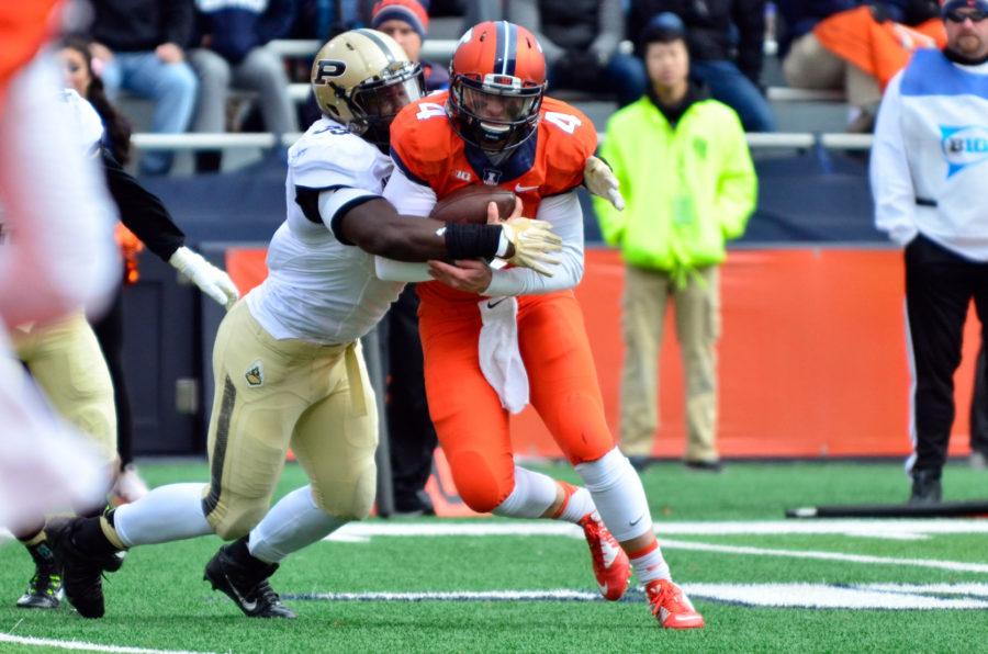 Illinois’ Reilly O’Toole is sacked by Purdue’s Ja’Whaun Bentley on Oct. 4. O’Toole came in to his freshman year as the backup quarterback for Nathan Scheelhaase. Entering this season as a senior, he was slated as the backup to transfer Wes Lunt.