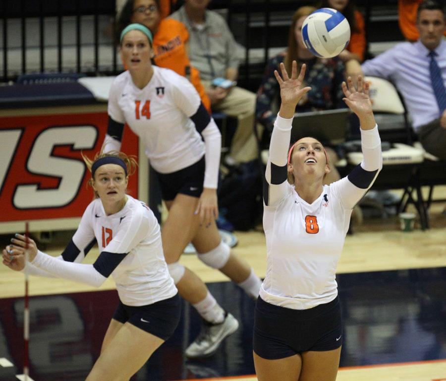 Illinois Alexis Villunas (8) sets the ball during the game against Rutgers at Huff Hall, on Sept. 27.