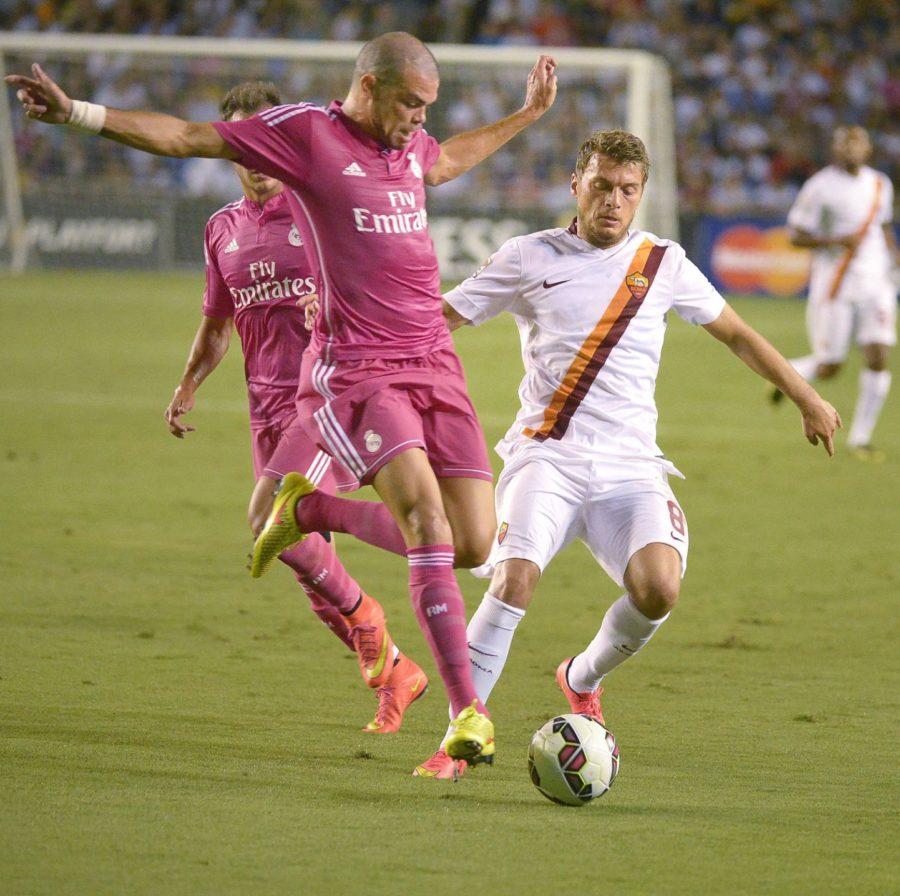 Real Madrids Pepe stops AS Romas Adem Ljajicin, right, in the Guinness International Champions Cup at the Cotton Bowl in Dallas on Tuesday, July 29, 2014.