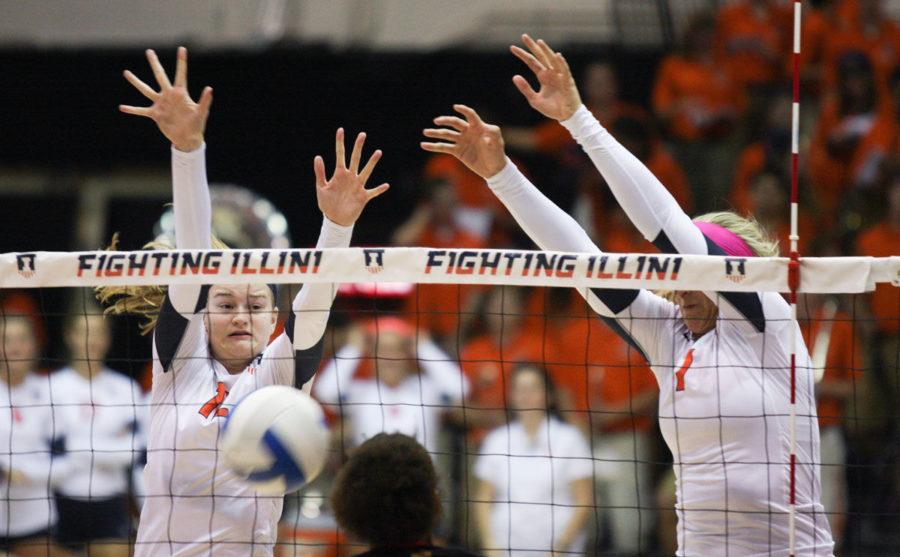 Illinois’ Katie Stadick (left) and Jocelynn Birks block a hit from Maryland during the game at Huff Hall on Sept. 26. Stadick was named the Big Ten Co-Defensive Player of the Week for the second-straight week.