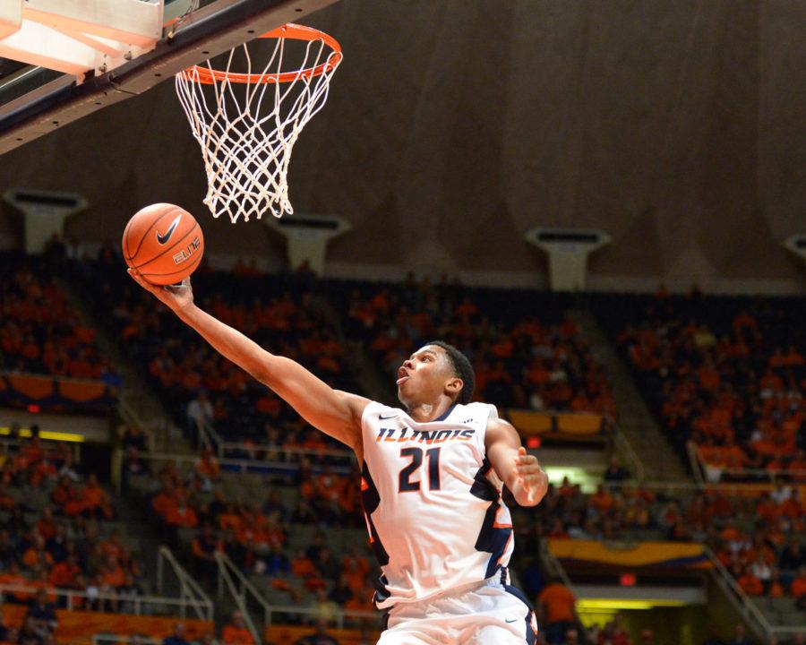 Illinois Malcolm Hill (21) does a layup during the exhibition game against Quincy at State Farm Center on Friday. The Illini won 91-62 and Hill led the team with 20 points.