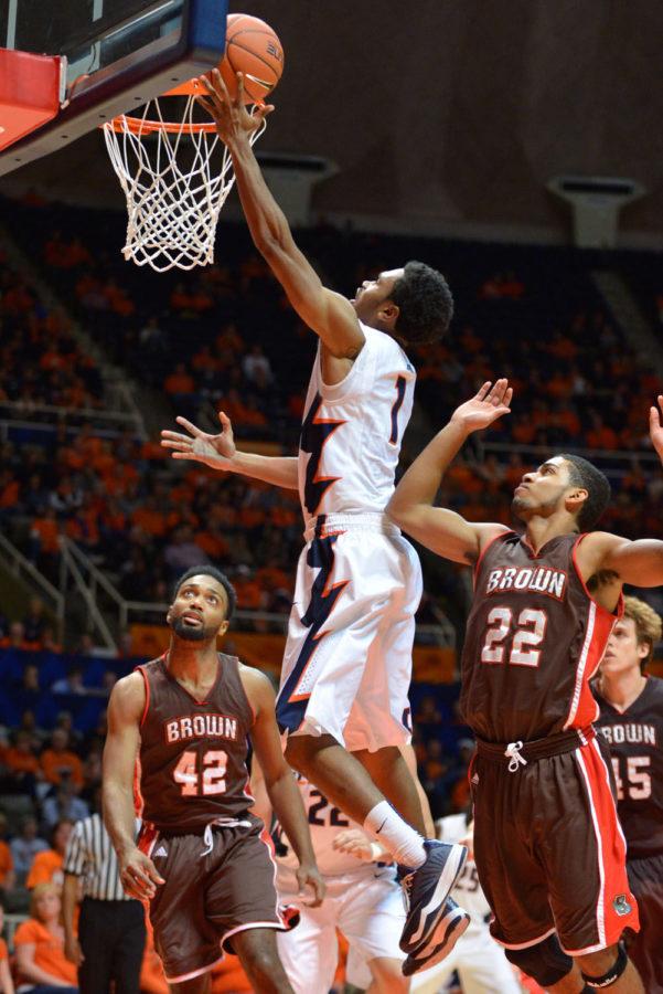 Illinois Jaylon Tate goes up for a lay up  against Brown at State Farm Center on Monday. Even though he hasnt scored much, Tate has impacted the team in other ways early this season. 