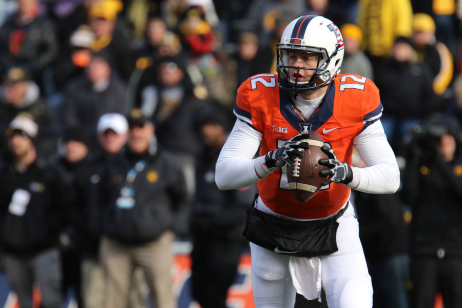 Illinois Wes Lunt (12) looks for an open pass during the game against Iowa at Memorial Stadium, on Saturday, Nov. 15, 2014. The Illini lost 30-14.