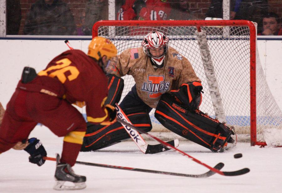Illinois’ Joe Olen defends a shot from Iowa State’s Nate Percy during Friday’s 3-1 Illini win. 