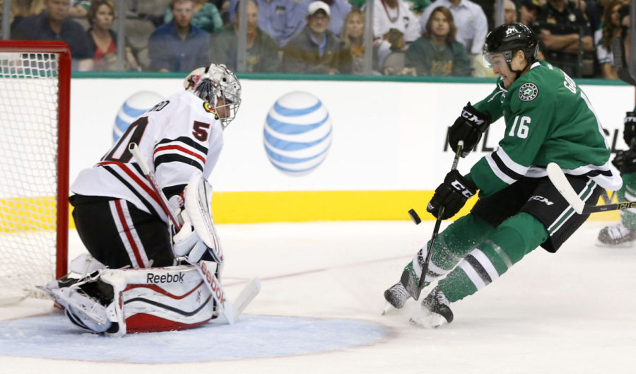 The Dallas Stars Ryan Garbutt takes a shot on goal before Chicago Blackhawks goalie Corey Crawford stops it during the first period at the American Airlines Center in Dallas on Thursday, Oct. 9, 2014. The Blackhawks won, 3-2, in a shootout. (Vernon Bryant/Dallas Morning News/MCT)