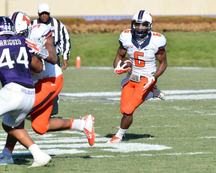 Illinois Josh Ferguson carries the ball during the game against Northwestern at Ryan Field in Evanston, Ill. on Saturday. Ferguson and quarterback Reilly OToole combined for 242 yards on the ground in the Illini win. 