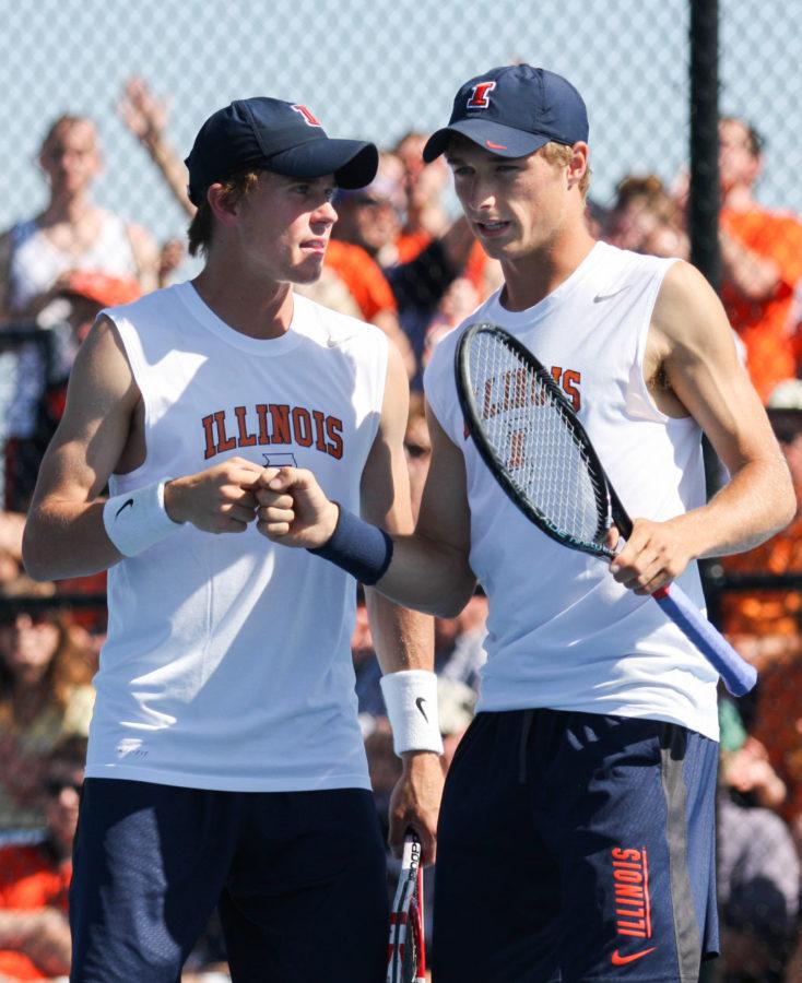 Illinois Tim Kopinski and Ross Guignon briefly celebrate during the NCAA Tennis Regionals against the University of Memphis at Khan Outdoor Tennis Complex on Saturday, May 10, 2014. The duo took second at the ITA Intercollegiate Indoor National Championships this past weekend.