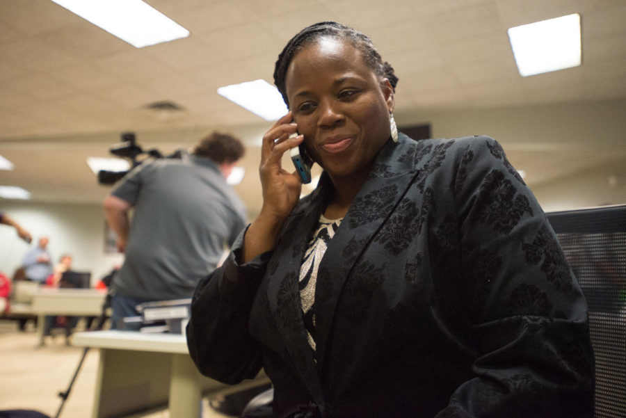 Newly elected 103rd District Illinois Representative Carol Ammons takes the concession call from opponent Kristin Williamson at the Brookens Administrative Center in Urbana on Tuesday.