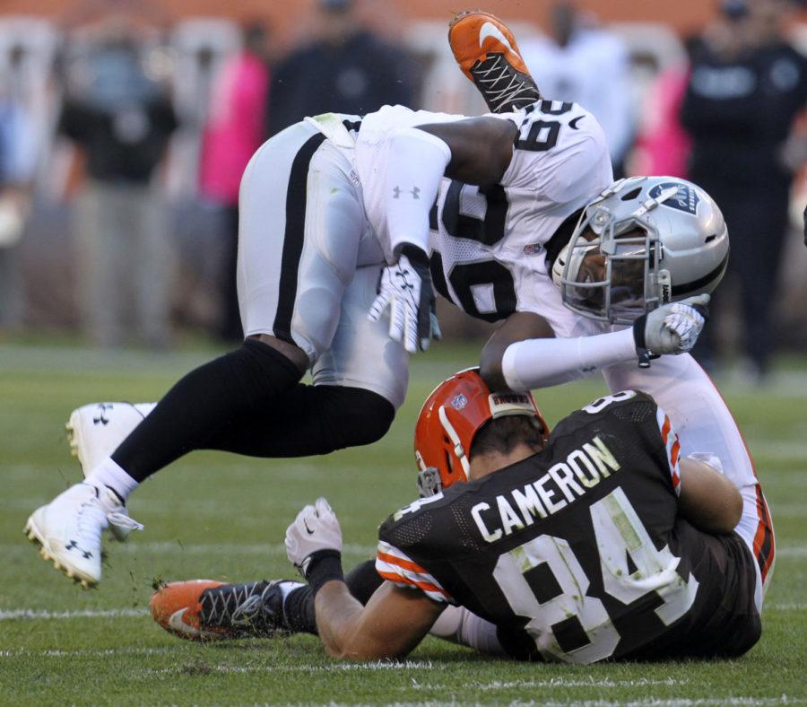 Cleveland Browns tight end Jordan Cameron left the game with a concussion after a hit by Oakland Raiders Brandian Ross during the second quarter on Sunday, Oct. 26, 2014, at FirstEnergy Stadium in Cleveland, Ohio. The Browns won the game 23-13. (Phil Masturzo/Akron Beacon Journal)