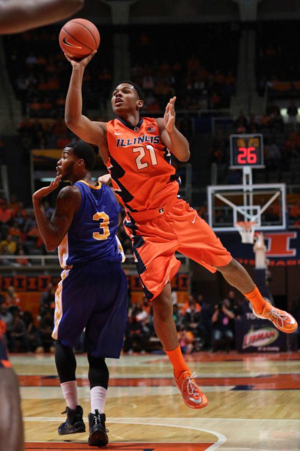 Illinois’ Malcolm Hill takes a shot after during the game against Coppin State on Sunday. Hill attributed the Illini’s opening night struggles to a “too-cool” mentality.