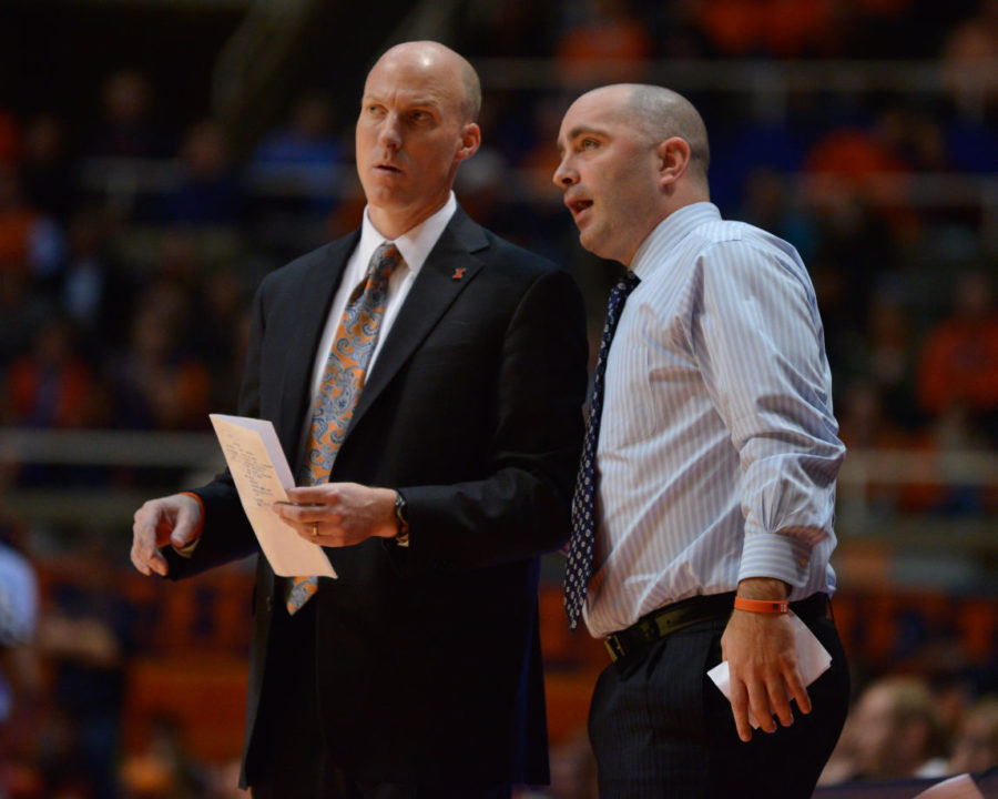 Illinois head coach John Groce and assistant coach Dustin Ford talk during the game against Brown at State Farm Center on Monday, Nov. 24, 2014. The Illini won 89-68.